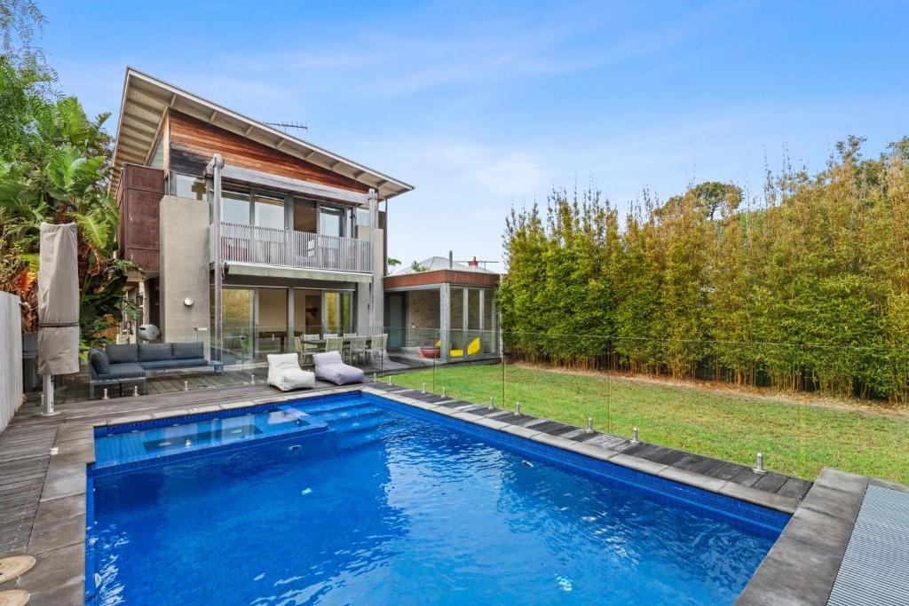 a swimming pool in the backyard of a house at Kingsley in Point Lonsdale