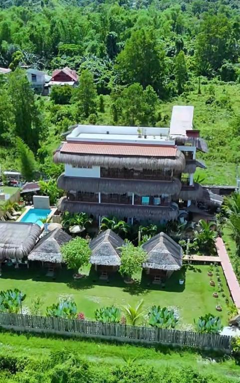 an aerial view of a resort building with a garden at La Palapa Inn Port Barton in San Vicente