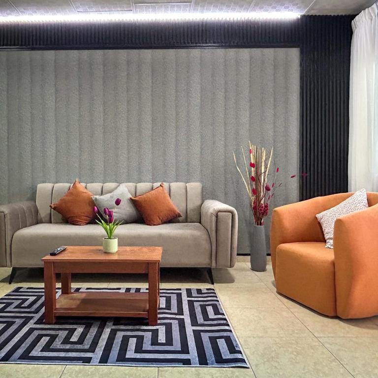 a living room with a couch and a coffee table at Oasis House 1 in Cabuya