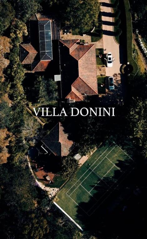 an overhead view of a tennis court with the words villa donutt at Villa Donini in Riverside