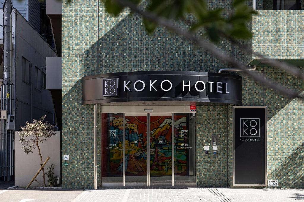 a koxo hotel sign on the side of a building at KOKO HOTEL Hakata Station in Fukuoka