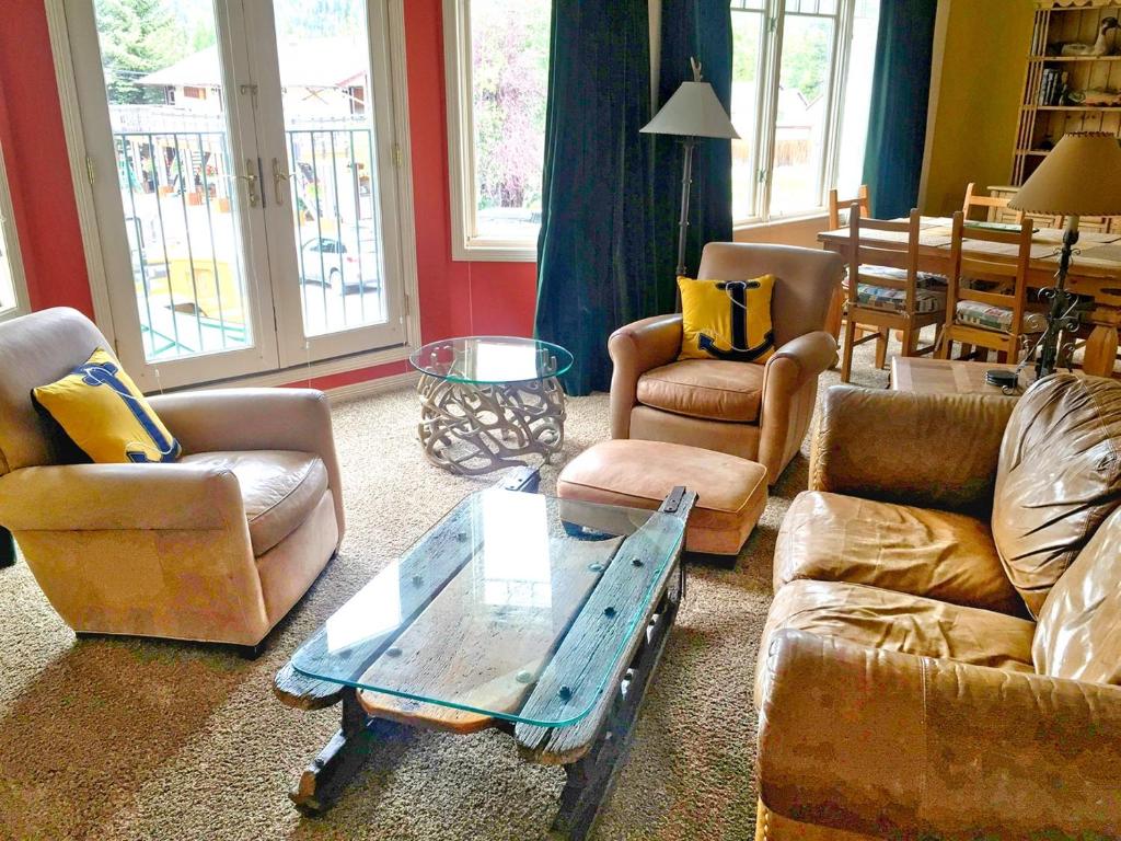 a living room with couches and a coffee table at Right on Main St Hot Tub Close to Marina Garage in Frisco