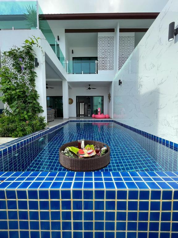 a bowl of fruit on the floor of a swimming pool at Koh Chang Luxury Pool Villas in Ko Chang