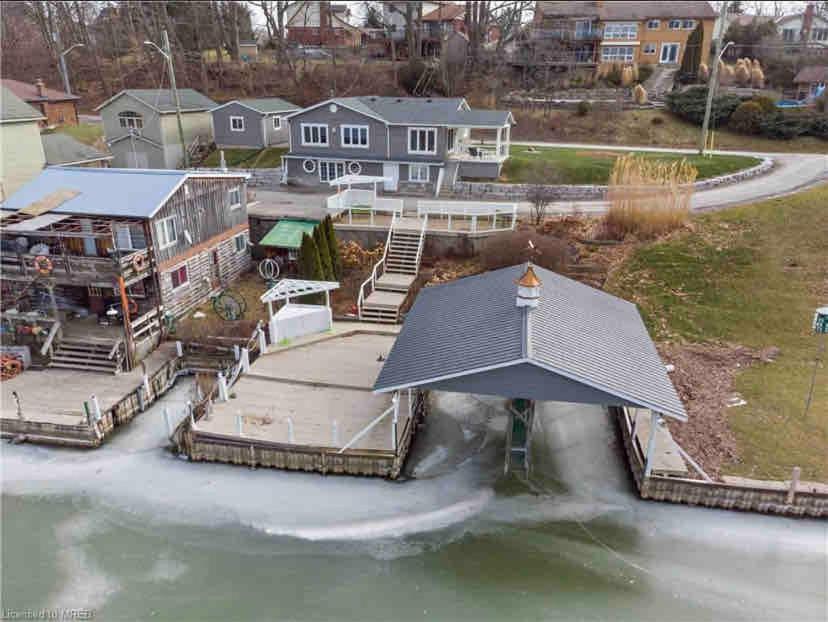 an aerial view of a house on the water at Cozy cottage on the River in Port Dover