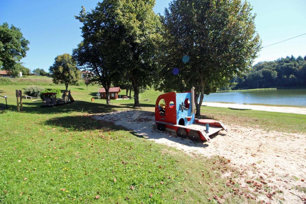 a small toy car parked on the shore of a park at Gîte 87G5513 in Sussac