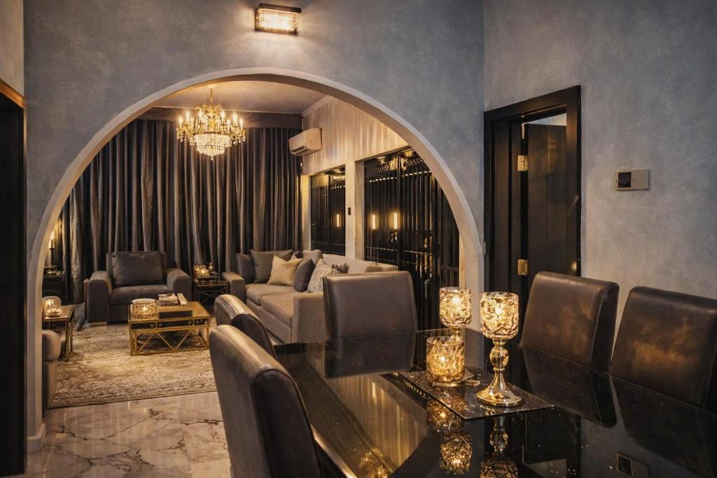 a living room with a couch and a table at Luxury 6 bedroom villa in independence layout 247 power parking and Wifi in Enugu