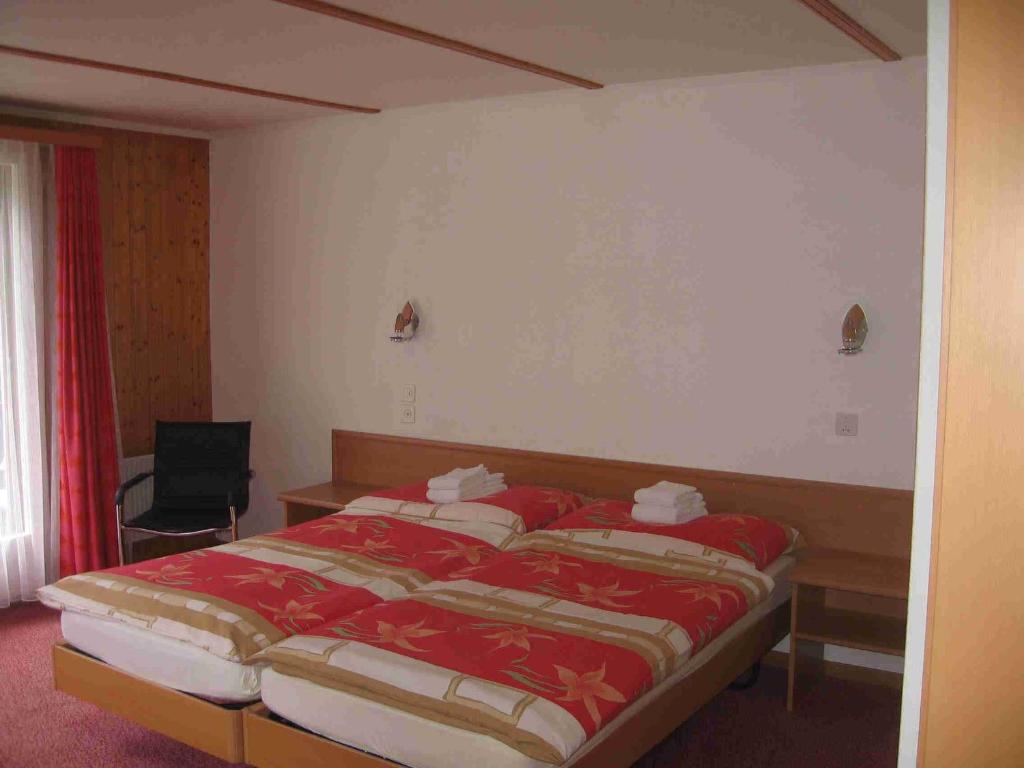 Postel nebo postele na pokoji v ubytování Hotel-Restaurant Stechelberg Bed & Breakfast