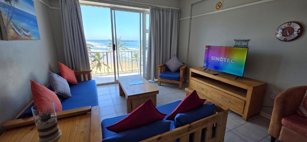 a living room with a couch and a tv with a view at Seabrook 404 - Sleeps 8 in Margate