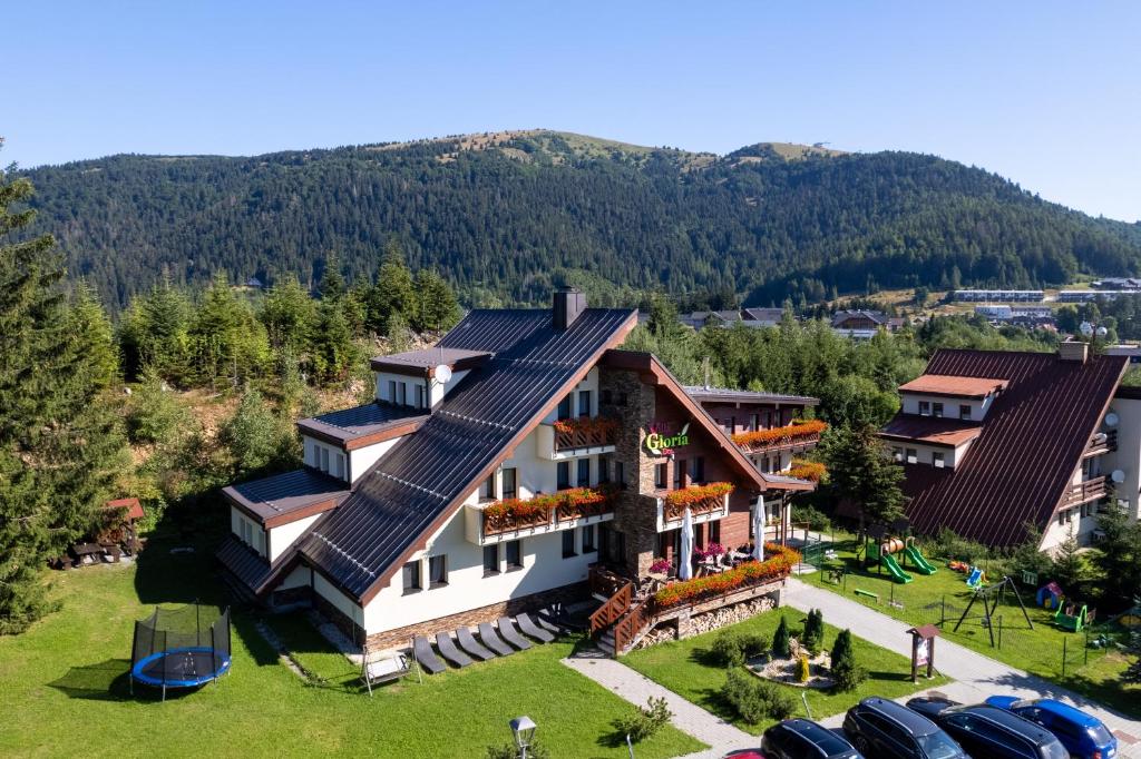 an aerial view of a house with solar panels on it at Villa Gloria Rooms & Apartments in Donovaly