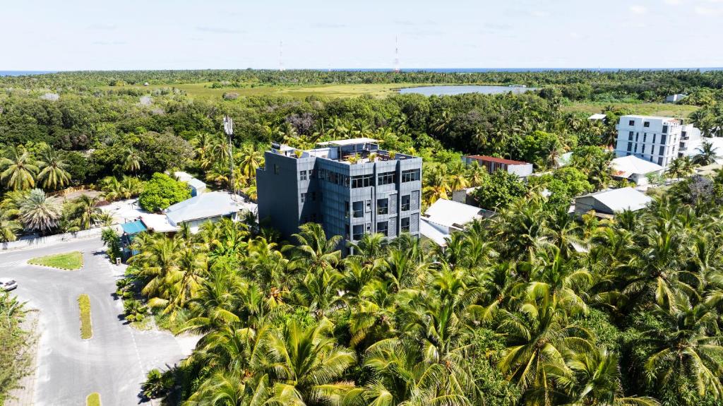 an aerial view of a resort surrounded by palm trees at Maa Thundi in Fuvahmulah