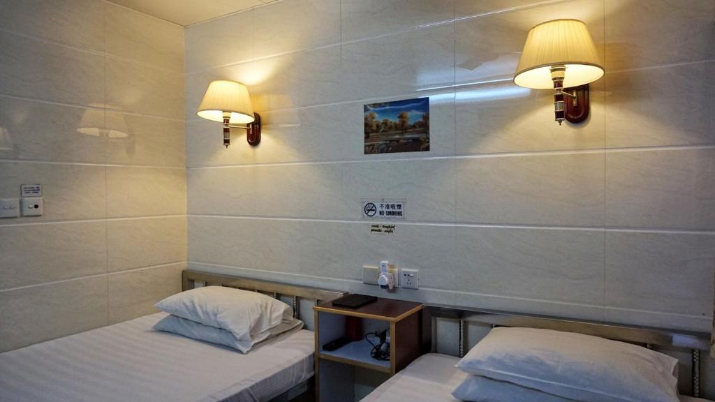 Postel nebo postele na pokoji v ubytování Maple Leaf Guest House