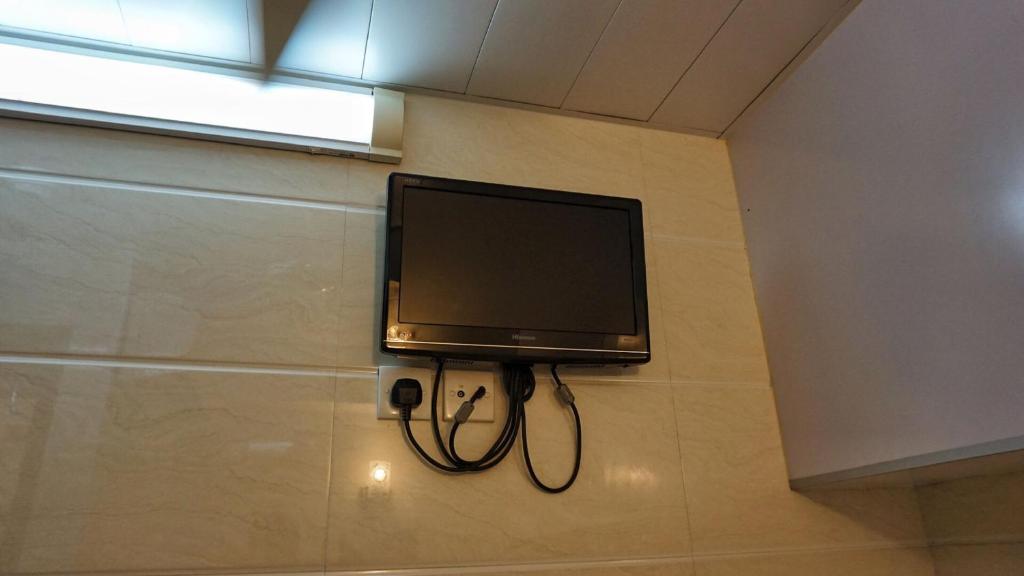TV a/nebo společenská místnost v ubytování Maple Leaf Guest House