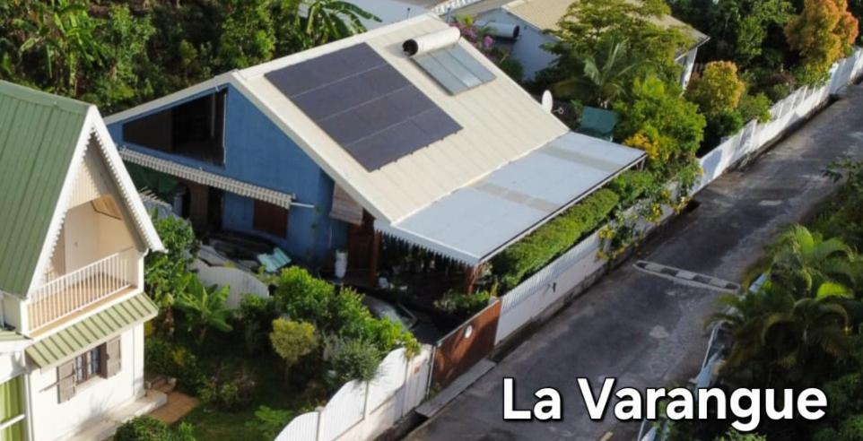 arial view of a house with a solar panel on it at La Varangue in La Possession
