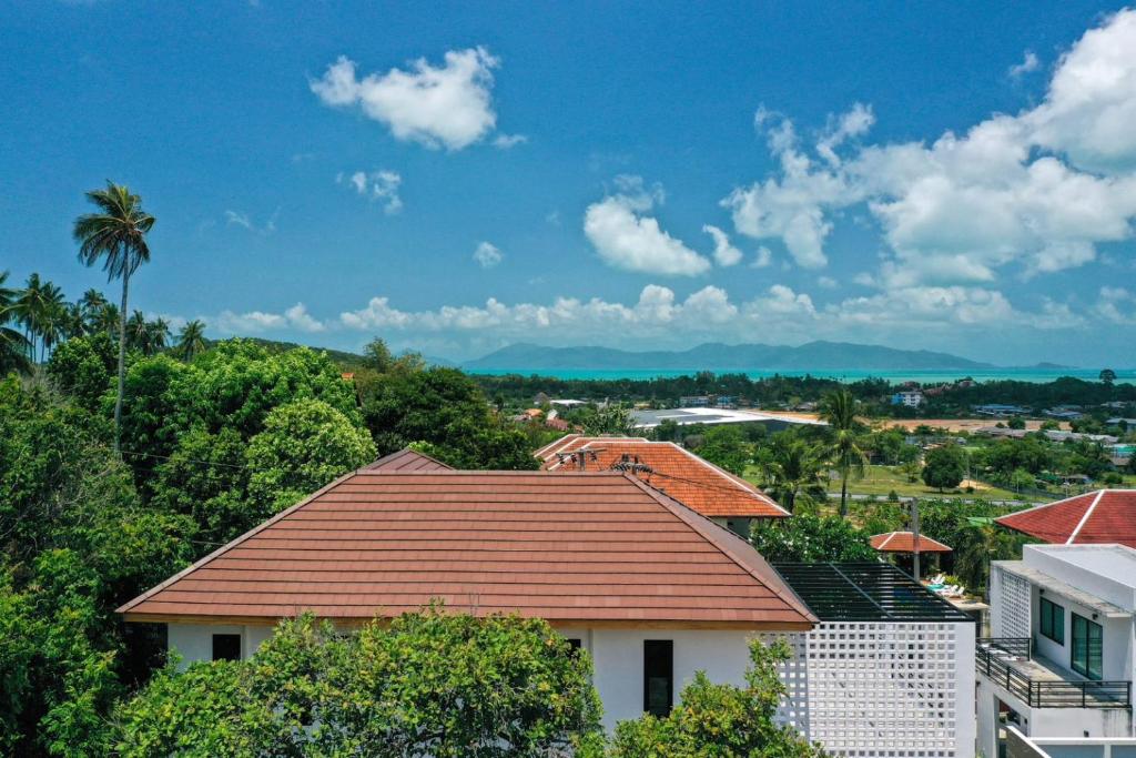 a view of a house with a roof at Rancho Relaxo Pool Villa in Nathon Bay