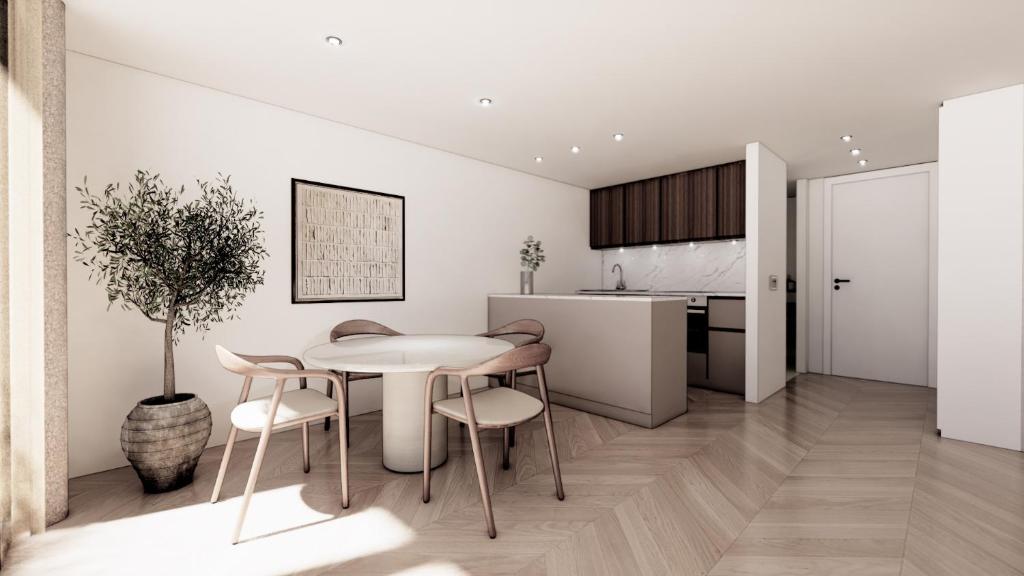 a kitchen and dining room with a table and chairs at Lakeside Studios Konstanz in Konstanz