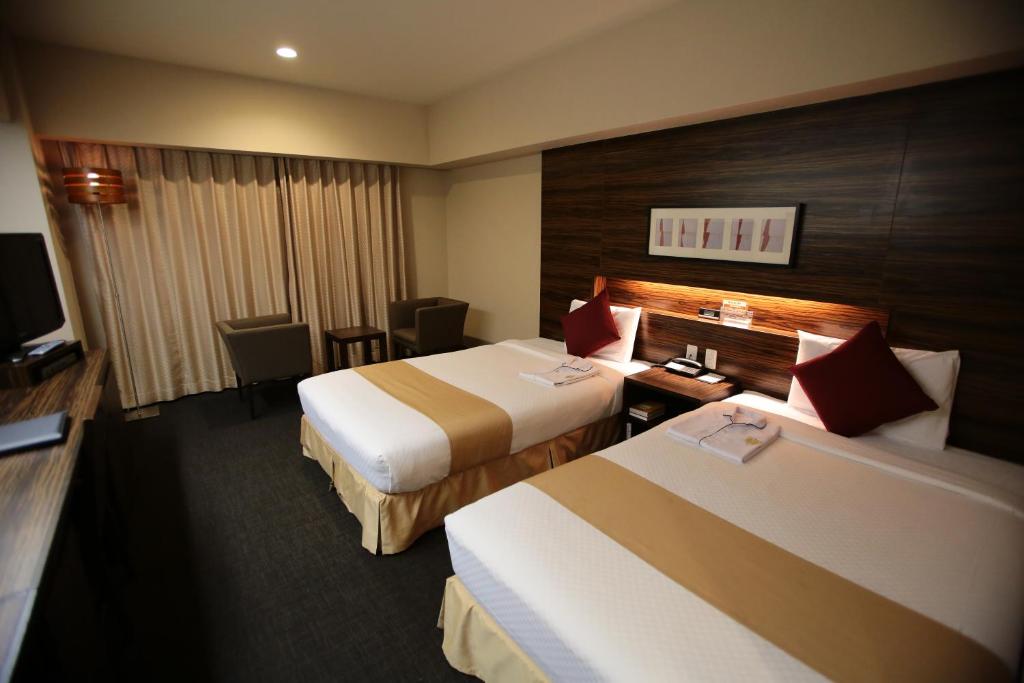Postel nebo postele na pokoji v ubytování International Hotel Ube