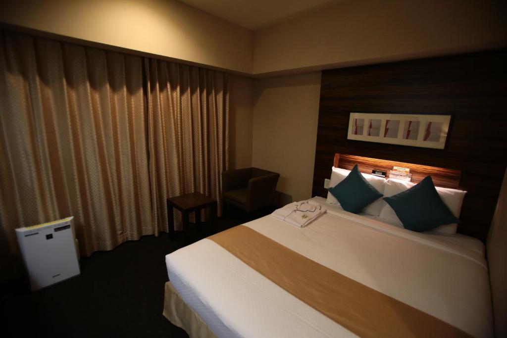 Postel nebo postele na pokoji v ubytování International Hotel Ube