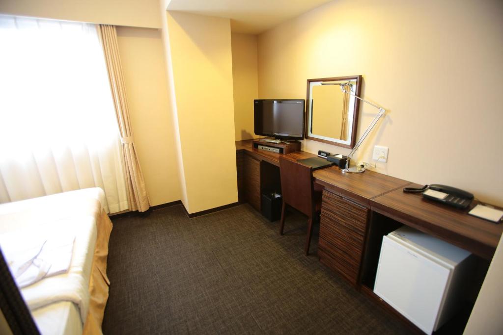 TV a/nebo společenská místnost v ubytování International Hotel Ube