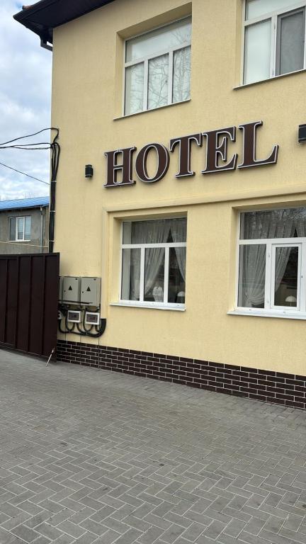 a hotel sign on the side of a building at Hotel GLORIA in Ceadîr-Lunga