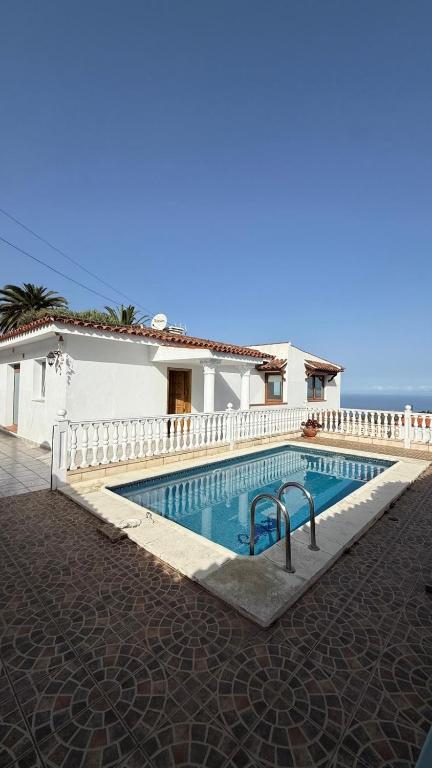 a swimming pool in front of a house at Holiday Feel - La Orotava in La Orotava