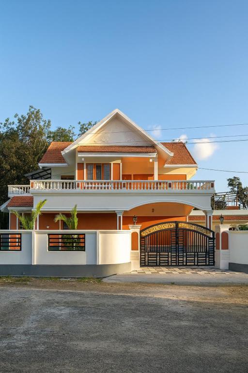 a house with a gate in front of it at Veranda Villa in Angamaly