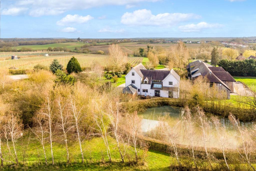 an aerial view of a house in a field at Tuffon Hall Farmhouse 10 in Sible Hedingham