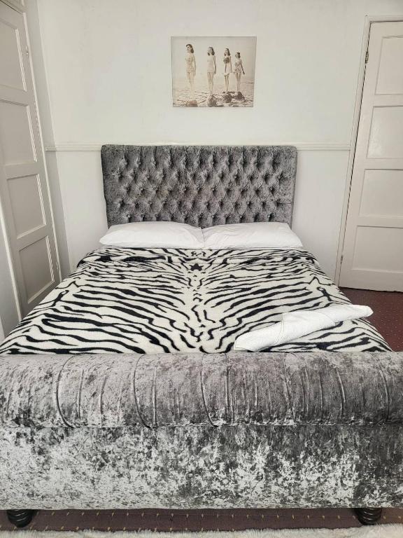 a zebra print bed in a white bedroom at Teeside Port in Middlesbrough in Middlesbrough