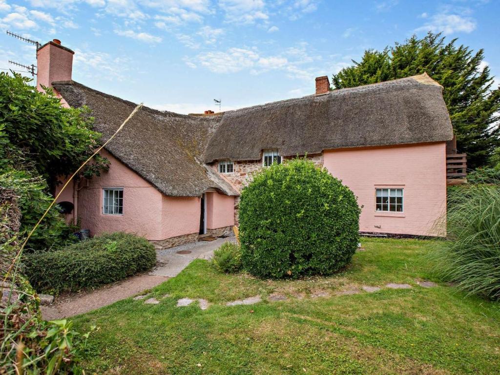 an old pink house with a thatched roof at 6 Bed in Taunton oc-95371 in Bicknoller