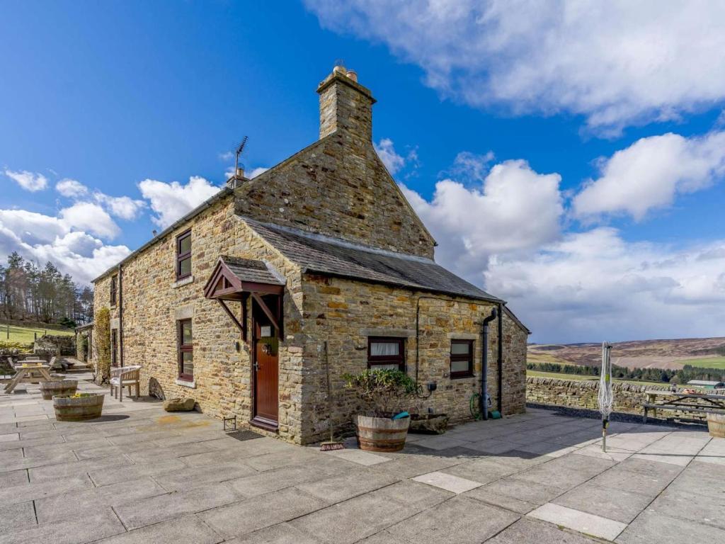 an old stone building on a patio at 3 Bed in Consett oc-cn195 in Hunstanworth