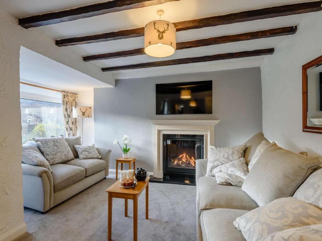 a living room with a couch and a fireplace at 2 Bed in Barnoldswick oc-83775 in Barnoldswick