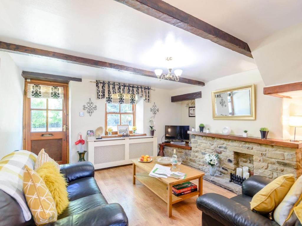 a living room with a couch and a fireplace at 2 Bed in Skipton oc-79093 in Skipton