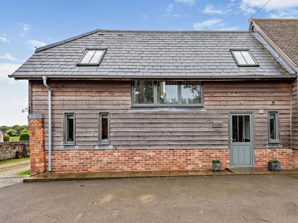 a brick house with a gray roof at 3 Bed in Salisbury oc-66130 in Redlynch