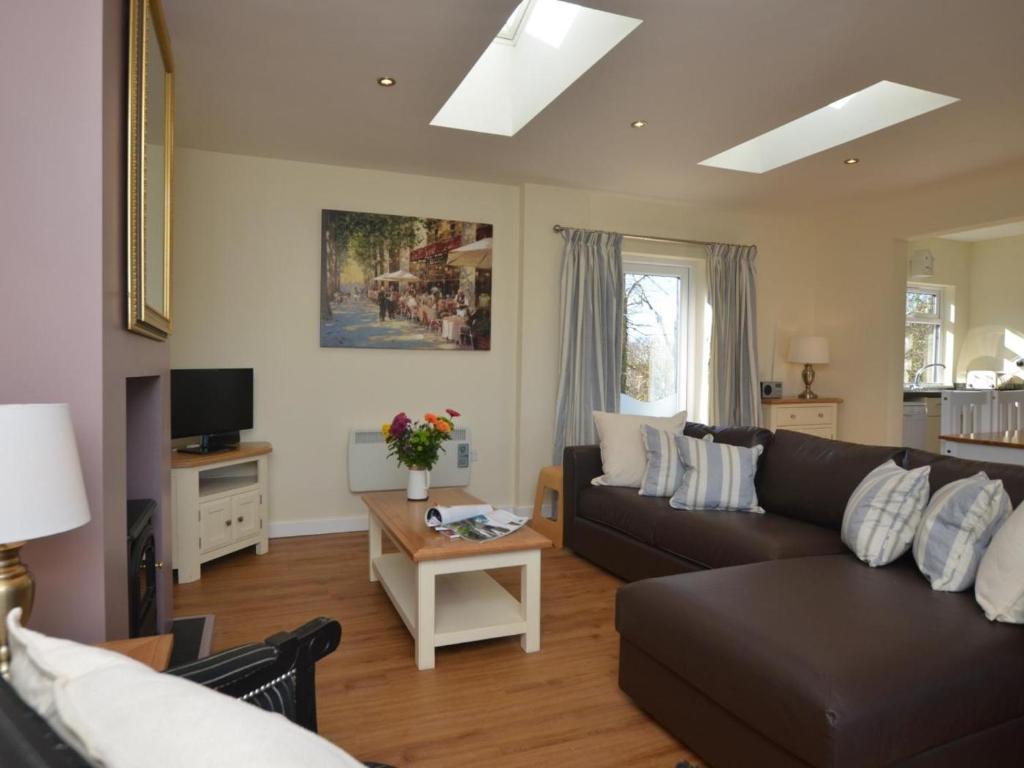 a living room with a couch and a table at 2 Bed in Kewstoke oc-57144 in Weston-super-Mare