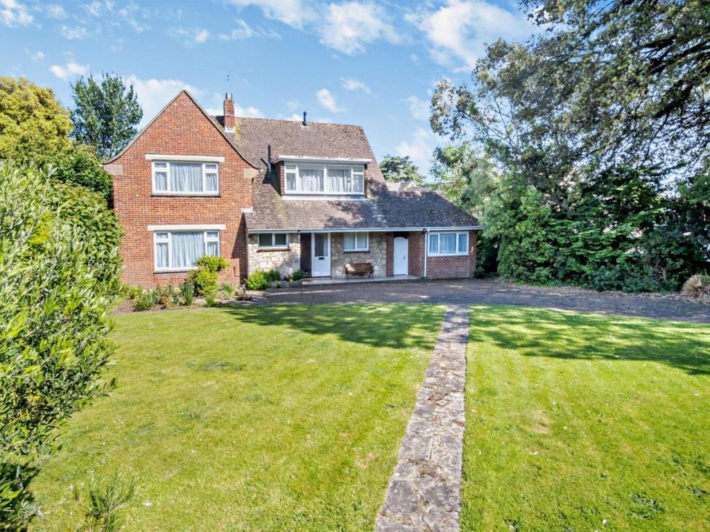 a house with a large yard in front of it at 4 Bed in Shanklin oc-ic068 in Shanklin