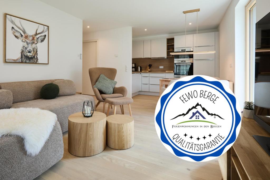 a living room with a sign that reads two bites mountain apartment at Alpenlodge LEO in Mittenwald