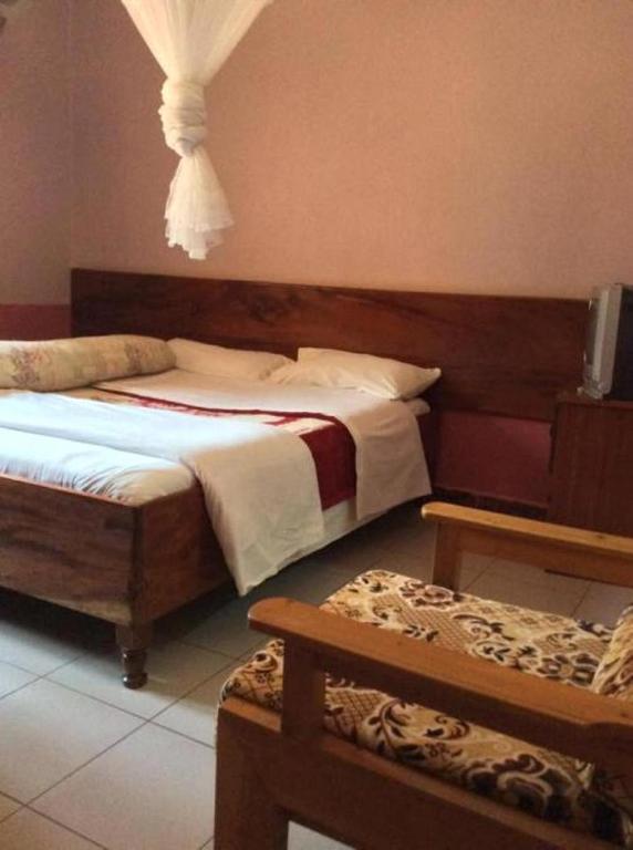 Postel nebo postele na pokoji v ubytování Starlight Hotel Mbale