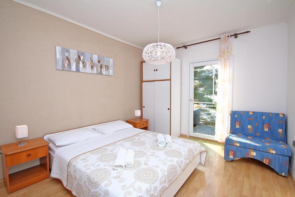 Posteľ alebo postele v izbe v ubytovaní Brela Beach house