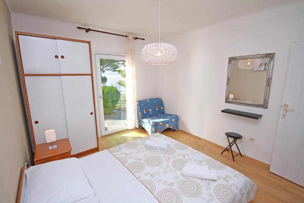 Posteľ alebo postele v izbe v ubytovaní Brela Beach house