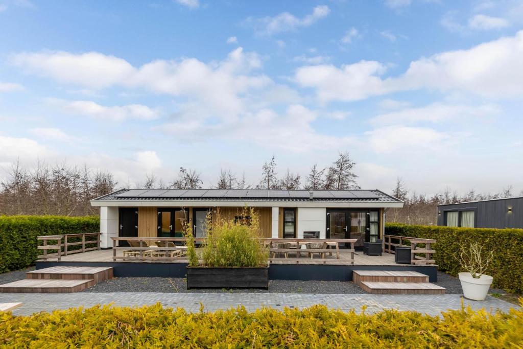 a building with benches and tables at Vakantiepark In Style in Dronrijp