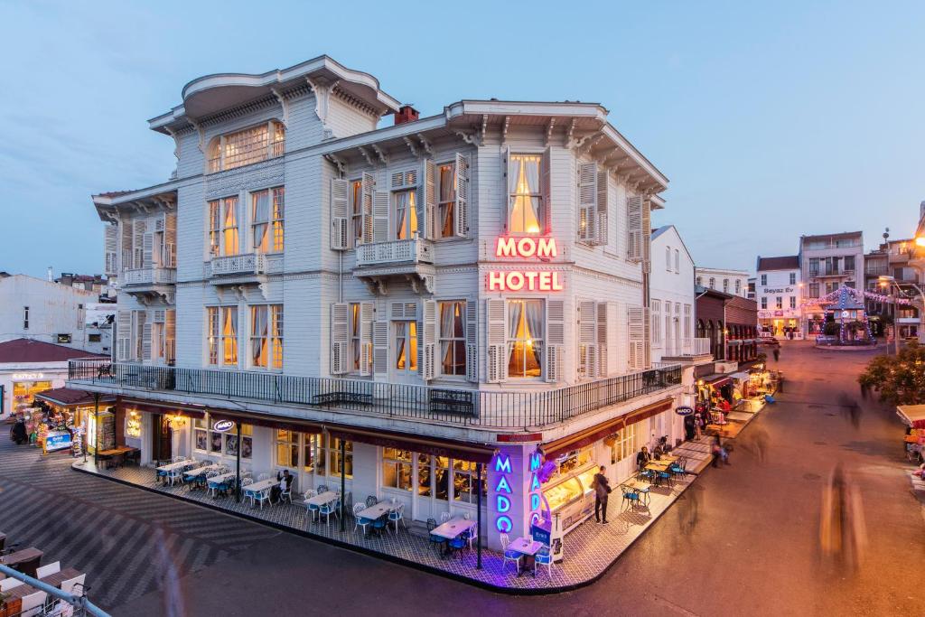 a large building with a mom hotel sign on it at Mom Hotel Buyukada in Adalar