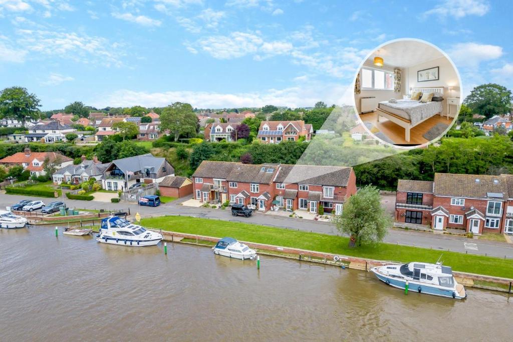 an image of a house with boats in the water at 2 Bed in Reedham oc-c29528 in Haddiscoe