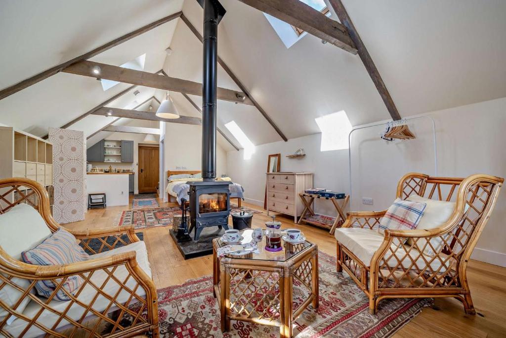 a living room with a wood stove in a room at 1 Bed in Broughton oc-b30218 in Broughton
