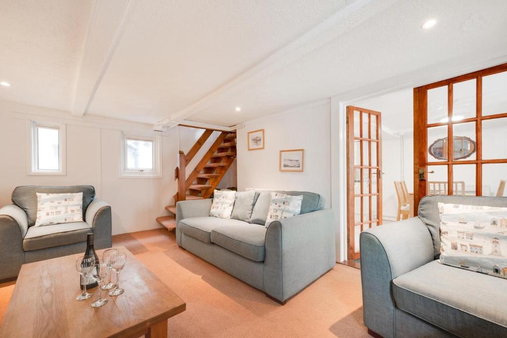 a living room with two couches and a table at 3 Bed in St Ives oc-pc1016 in St Ives