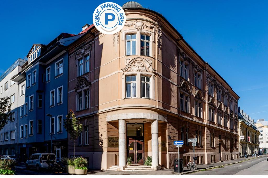 a building with a sign on the side of it at Elisabeth Old Town in Bratislava