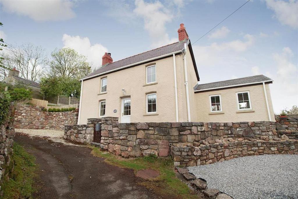 a white house with a stone wall at 2 Bed in Llanmadoc oc-hh469 in Llanmadoc