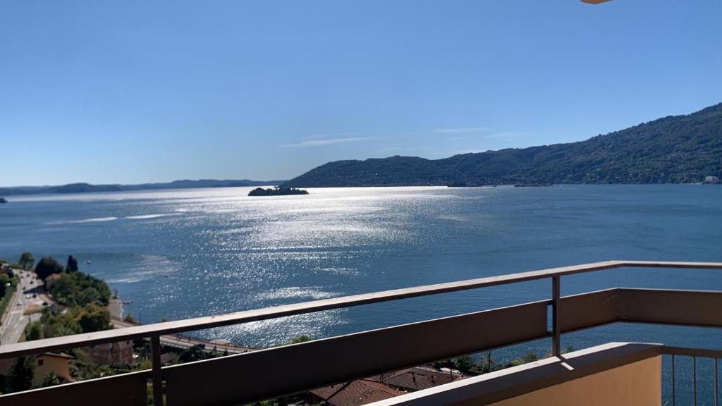 a view of a large body of water from a balcony at Suite bijoux On Lake Maggiore in Verbania