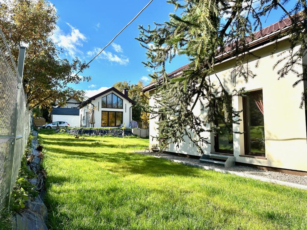 a house with a yard in front of it at Bocian nad Bugiem in Mierzwice