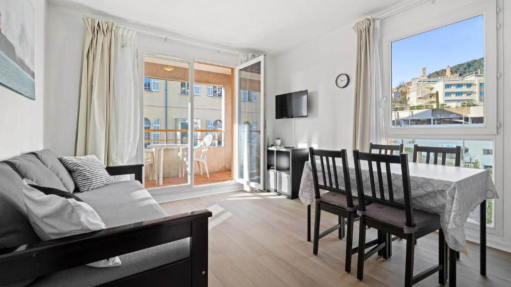 a living room with a table and a dining room at Virginia N 410 2P4 in Grasse