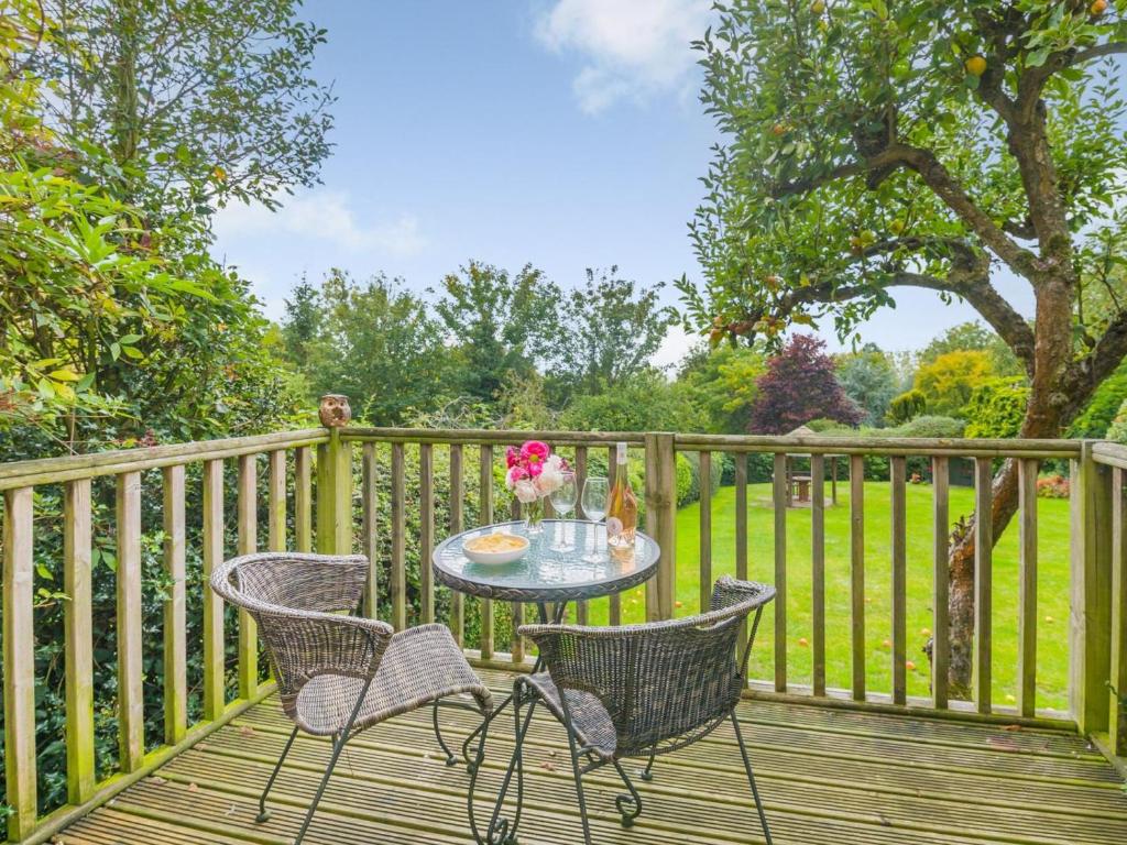 a table and chairs on a wooden deck at 1 Bed in York oc-g0032 in Crayke
