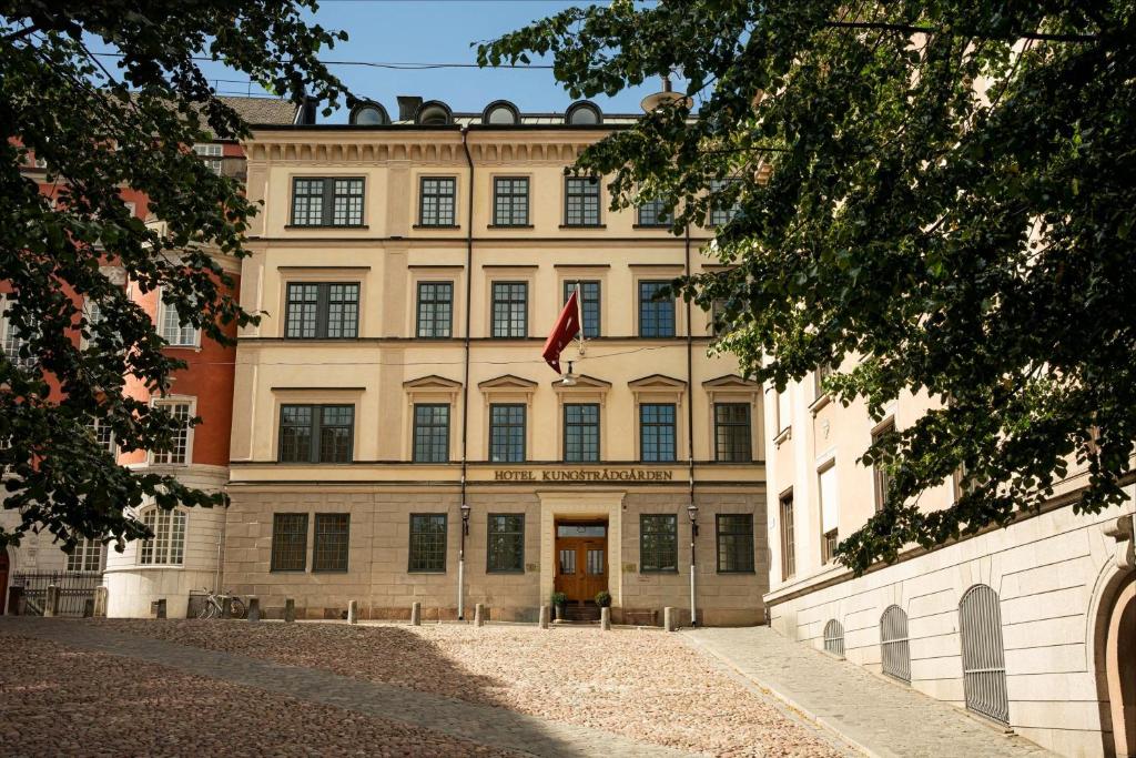 a building with a flag in front of it at Hotel Kungsträdgården in Stockholm